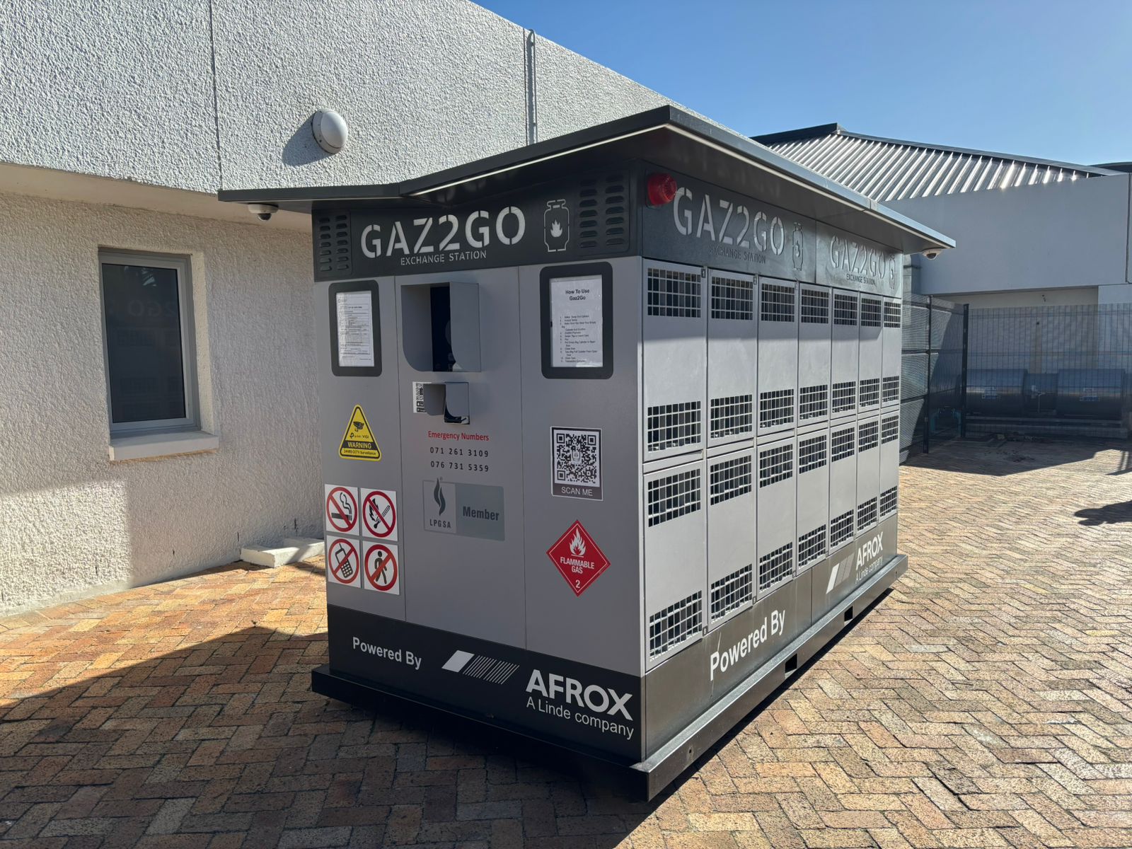 GAZ2GO exchange station — full unit showing gas cylinder locker bays, GAZ2GO exchange station signage, and AFROX partnership branding